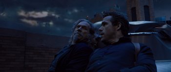 Movie still from “R.I.P.D.” (2013), directed by Robert Schwentke – A couple of men standing next to each other; Medium shot, Low angle