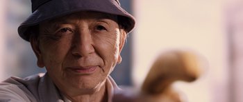 Movie still from “R.I.P.D.” (2013), directed by Robert Schwentke – An older man wearing a hat looking into the camera; Close Up shot, Low angle