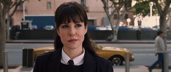 Movie still from “R.I.P.D.” (2013), directed by Robert Schwentke – A person wearing a suit and tie; Close Up shot, Over the shoulder angle