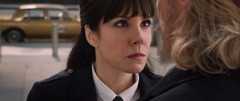 Movie still from “R.I.P.D.” (2013), directed by Robert Schwentke – A person wearing a suit and tie; Close Up shot, Over the shoulder angle