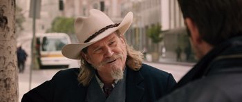 Movie still from “R.I.P.D.” (2013), directed by Robert Schwentke – A person wearing a cowboy hat; Close Up shot, Over the shoulder angle