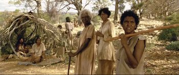 Movie still from “Rabbit-Proof Fence” (2002), directed by Phillip Noyce – A group of people standing in a field; Medium shot, High angle