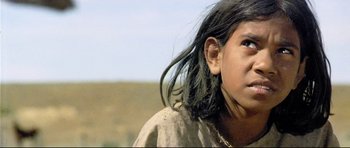 Movie still from “Rabbit-Proof Fence” (2002), directed by Phillip Noyce – A person with long black hair; Close Up shot, Low angle
