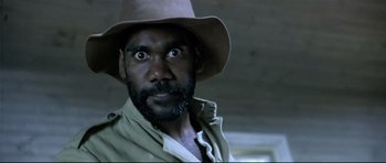 Movie still from “Rabbit-Proof Fence” (2002), directed by Phillip Noyce – A person wearing a hat; Close Up shot, Over the shoulder angle
