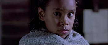 Movie still from “Rabbit-Proof Fence” (2002), directed by Phillip Noyce – A child with a sweater on; Close Up shot, High angle