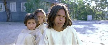 Movie still from “Rabbit-Proof Fence” (2002), directed by Phillip Noyce – A group of young people standing next to each other; Close Up shot, High angle