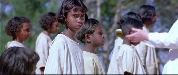 Movie still from “Rabbit-Proof Fence” (2002), directed by Phillip Noyce – A group of young people standing next to each other; Close Up shot, Over the shoulder angle