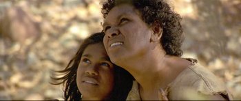 Movie still from “Rabbit-Proof Fence” (2002), directed by Phillip Noyce – A woman and a child looking up at the sky; Close Up shot, Low angle
