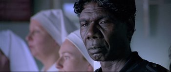 Movie still from “Rabbit-Proof Fence” (2002), directed by Phillip Noyce – An older man and a young woman are looking into the distance; Close Up shot, Low angle