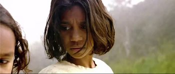 Movie still from “Rabbit-Proof Fence” (2002), directed by Phillip Noyce – A person with long brown hair; Close Up shot, High angle
