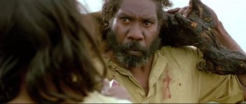 Movie still from “Rabbit-Proof Fence” (2002), directed by Phillip Noyce – A person with a beard; Close Up shot, Over the shoulder angle