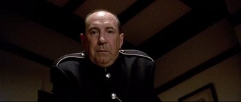 Movie still from “Rabbit-Proof Fence” (2002), directed by Phillip Noyce – An older man wearing a uniform and a hat; Close Up shot, Low angle