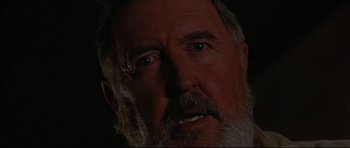 Movie still from “Rabbit-Proof Fence” (2002), directed by Phillip Noyce – An old man with a beard and a white mustache; Extreme Close Up shot, Low angle