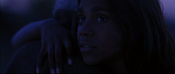 Movie still from “Rabbit-Proof Fence” (2002), directed by Phillip Noyce – A young girl is looking into the dark; Close Up shot, Over the shoulder angle