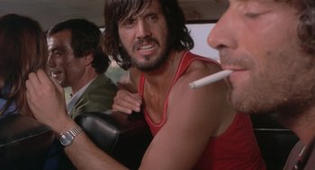 Movie still from “Rabid Dogs” (1974), directed by Mario Bava – A group of men sitting next to each other in a car; Close Up shot, Low angle