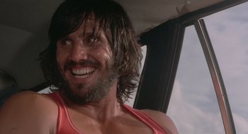 Movie still from “Rabid Dogs” (1974), directed by Mario Bava – A person with long hair and a beard; Close Up shot, Low angle