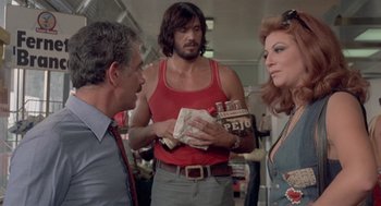 Movie still from “Rabid Dogs” (1974), directed by Mario Bava – A group of people standing around each other; Medium shot, Over the shoulder angle