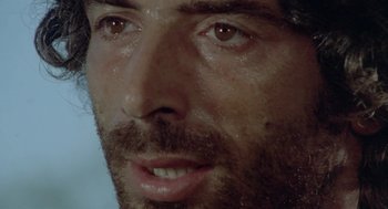 Movie still from “Rabid Dogs” (1974), directed by Mario Bava – A man's face with water on his face; Extreme Close Up shot, Low angle