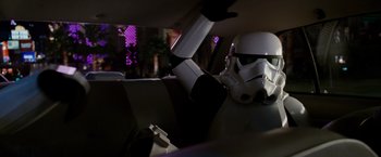 Movie still from “Race to Witch Mountain” (2009), directed by Andy Fickman – A star wars helmet sitting in the passenger seat of a car; Medium shot, Over the shoulder angle