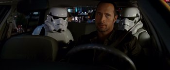 Movie still from “Race to Witch Mountain” (2009), directed by Andy Fickman – A man in a car next to a star wars stormtrooper; Close Up shot, Over the shoulder angle