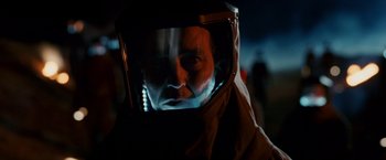 Movie still from “Race to Witch Mountain” (2009), directed by Andy Fickman – A man wearing a protective suit is looking into a mirror; Close Up shot, Low angle