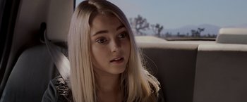 Movie still from “Race to Witch Mountain” (2009), directed by Andy Fickman – A woman with long blonde hair sitting in the back of a car; Close Up shot, Over the shoulder angle