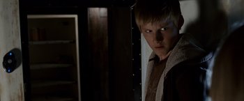 Movie still from “Race to Witch Mountain” (2009), directed by Andy Fickman – A young man standing in a dark room; Close Up shot, Low angle