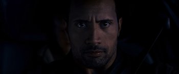 Movie still from “Race to Witch Mountain” (2009), directed by Andy Fickman – A man's face in the dark; Close Up shot, Over the shoulder angle
