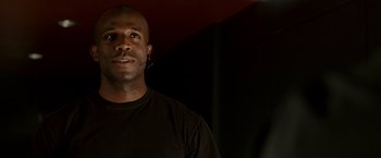 Movie still from “Race to Witch Mountain” (2009), directed by Andy Fickman – A person wearing a black t - shirt; Close Up shot, Low angle