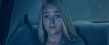 Movie still from “Race to Witch Mountain” (2009), directed by Andy Fickman – A young blonde haired woman with blue eyes looking sad; Close Up shot, Over the shoulder angle