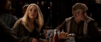 Movie still from “Race to Witch Mountain” (2009), directed by Andy Fickman – A woman sitting at a table with a bottle of ketchup; Close Up shot, Over the shoulder angle