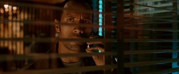 Movie still from “Race to Witch Mountain” (2009), directed by Andy Fickman – A man holding a cell phone up to his ear; Close Up shot, Low angle