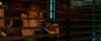 Movie still from “Race to Witch Mountain” (2009), directed by Andy Fickman – A man talking on a cell phone through a window; Close Up shot, Low angle