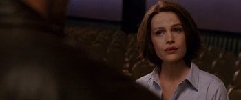 Movie still from “Race to Witch Mountain” (2009), directed by Andy Fickman – A person sitting in front of a projector screen; Close Up shot, Over the shoulder angle