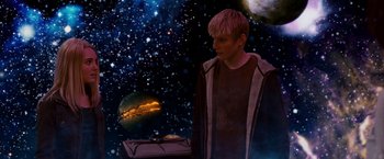 Movie still from “Race to Witch Mountain” (2009), directed by Andy Fickman – A man standing in front of a space background; Medium shot, Low angle