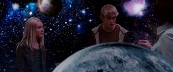 Movie still from “Race to Witch Mountain” (2009), directed by Andy Fickman – A young boy is looking at the earth in the background; Medium shot, Low angle