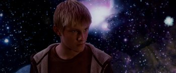 Movie still from “Race to Witch Mountain” (2009), directed by Andy Fickman – A young man with blonde hair is looking into the distance; Medium shot, Low angle