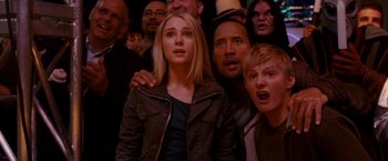 Movie still from “Race to Witch Mountain” (2009), directed by Andy Fickman – A group of people that are standing in a room together; Close Up shot, Low angle