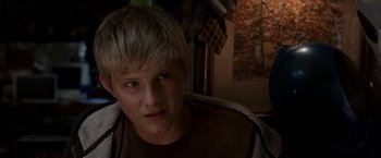 Movie still from “Race to Witch Mountain” (2009), directed by Andy Fickman – A person with short blonde hair; Close Up shot, Over the shoulder angle