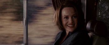 Movie still from “Race to Witch Mountain” (2009), directed by Andy Fickman – A woman with short brown hair smiling for the camera; Close Up shot, Over the shoulder angle