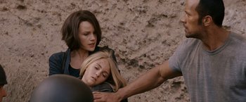 Movie still from “Race to Witch Mountain” (2009), directed by Andy Fickman – A woman holding a man's arm over a woman's head; Close Up shot, Over the shoulder angle