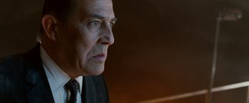 Movie still from “Race to Witch Mountain” (2009), directed by Andy Fickman – An older man in a suit and tie looking to his left; Close Up shot, Low angle