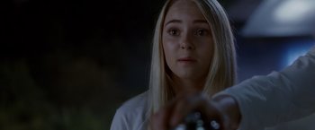 Movie still from “Race to Witch Mountain” (2009), directed by Andy Fickman – A woman is holding a camera in her hand; Close Up shot, Over the shoulder angle