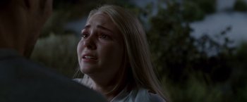 Movie still from “Race to Witch Mountain” (2009), directed by Andy Fickman – A woman with long blonde hair is crying; Close Up shot, Over the shoulder angle