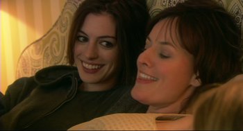 Movie still from “Rachel Getting Married” (2008), directed by Jonathan Demme – Two beautiful women sitting next to each other; Close Up shot, Overhead angle