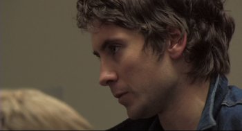 Movie still from “Rachel Getting Married” (2008), directed by Jonathan Demme – A man's face as he stares into the distance; Close Up shot, Over the shoulder angle