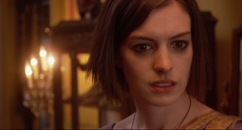Movie still from “Rachel Getting Married” (2008), directed by Jonathan Demme – A person with short brown hair; Close Up shot, Over the shoulder angle