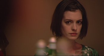 Movie still from “Rachel Getting Married” (2008), directed by Jonathan Demme – A person with short black hair; Close Up shot, Over the shoulder angle