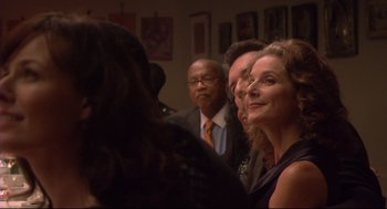 Movie still from “Rachel Getting Married” (2008), directed by Jonathan Demme – A group of people standing next to each other in a room; Close Up shot, Over the shoulder angle