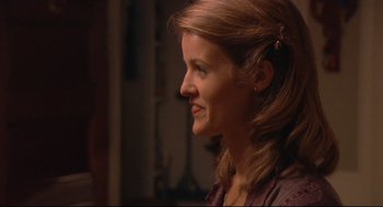 Movie still from “Rachel Getting Married” (2008), directed by Jonathan Demme – A person with long brown hair; Close Up shot, Over the shoulder angle
